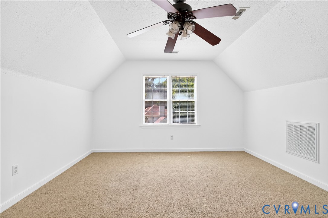 6125 Waterman Place Chesterfield, VA 23832 - Photo 32 of 45 Bonus room featuring vaulted ceiling, a textured c