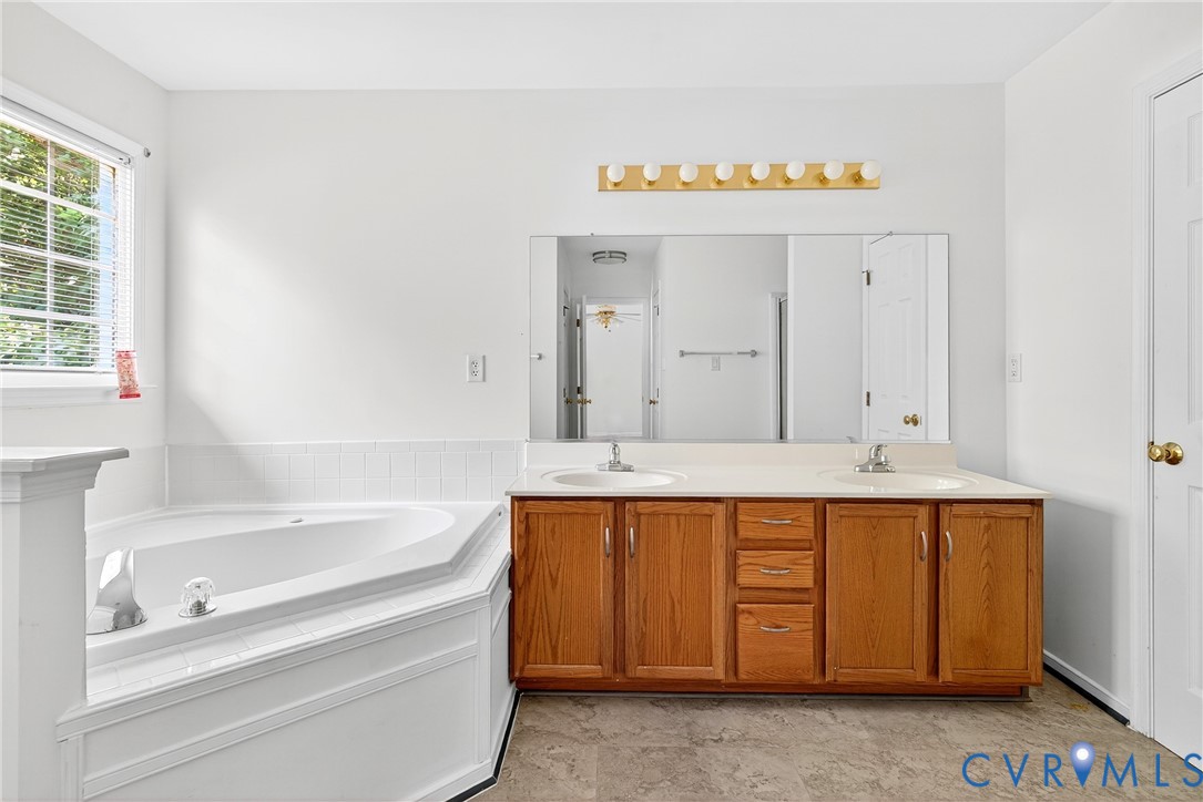 6125 Waterman Place Chesterfield, VA 23832 - Photo 33 of 45 Bathroom with a garden tub and double vanity
