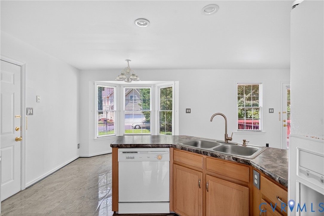 6125 Waterman Place Chesterfield, VA 23832 - Photo 9 of 45 a open kitchen with granite countertop a sink stove and cabinets