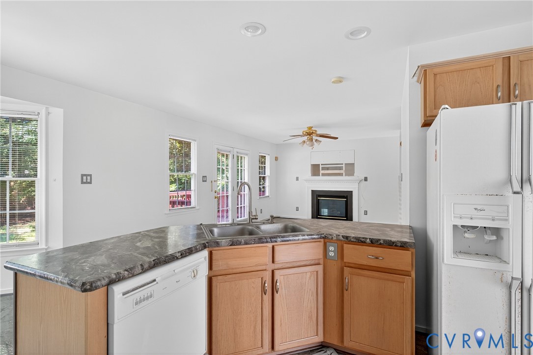 6125 Waterman Place Chesterfield, VA 23832 - Photo 45 of 45 a kitchen with granite countertop a sink stove and refrigerator