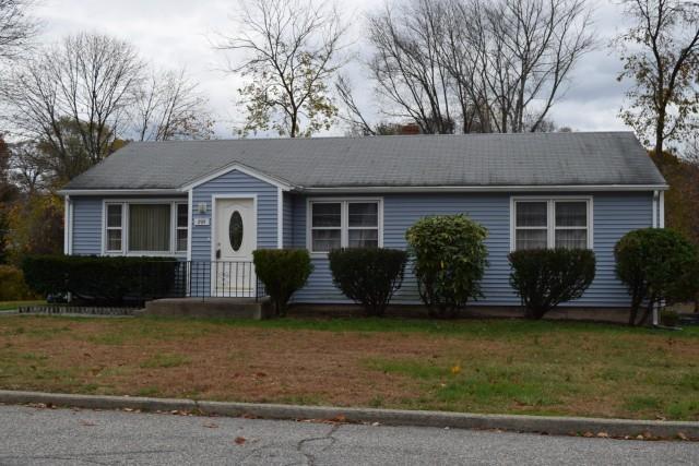 295 Red Oak Road Bridgeport, CT 06606 - Photo 1 of 1 a view of a house with a yard plants and large tree