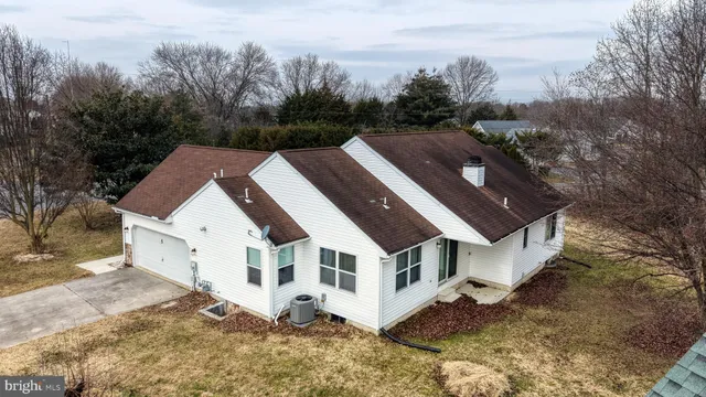 a aerial view of a house with a yard