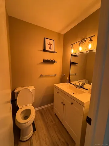 a bathroom with a toilet and a sink