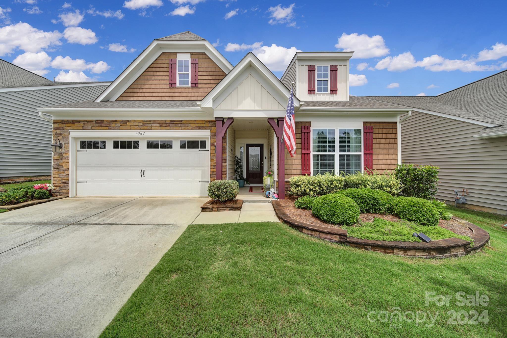 4362 Perth Road Fort Mill, SC 29707 - Photo 1 of 34 a front view of a house with a yard and garage