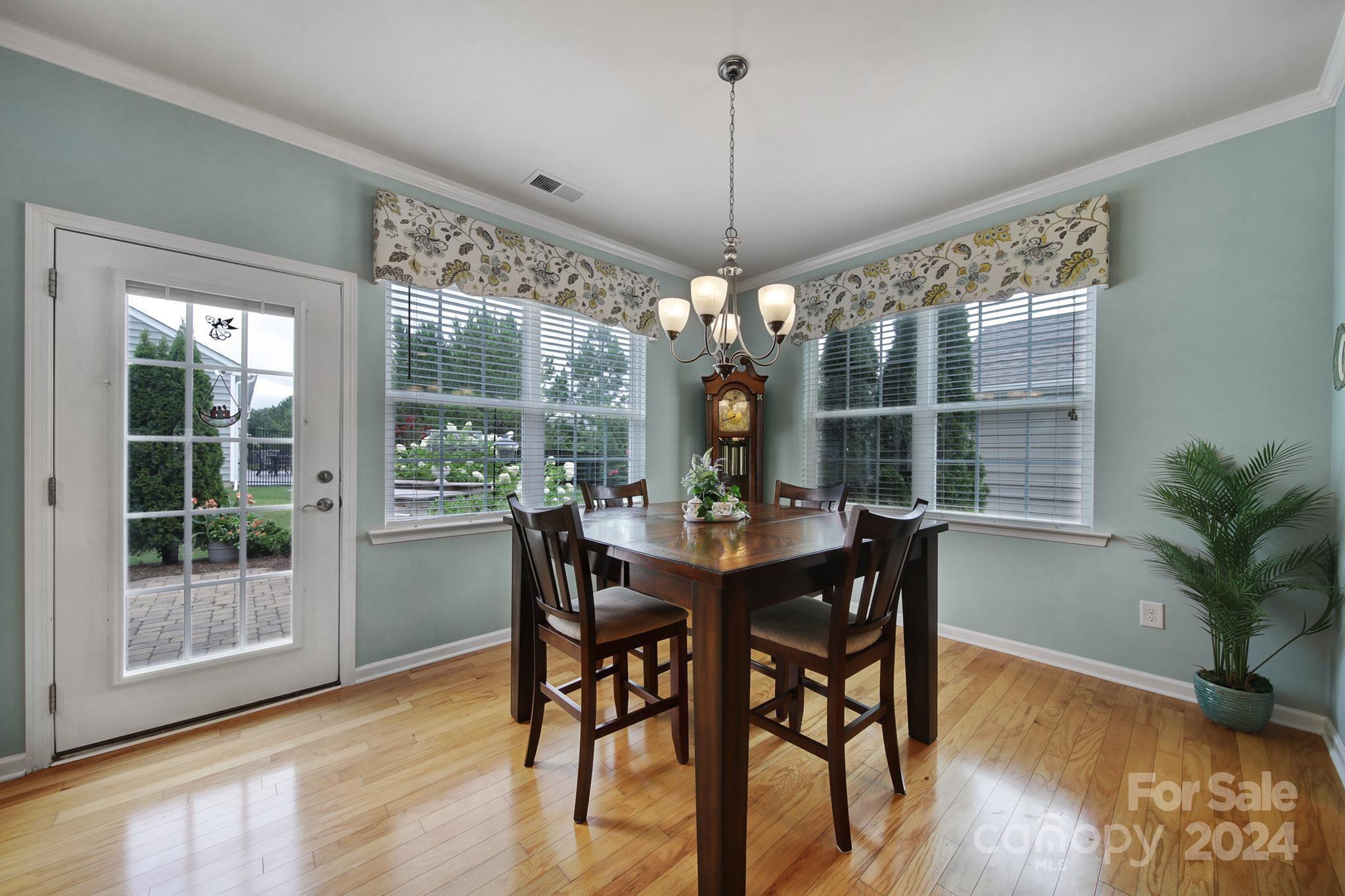 4362 Perth Road Fort Mill, SC 29707 - Photo 11 of 34 a view of a dining room with furniture window and wooden floor