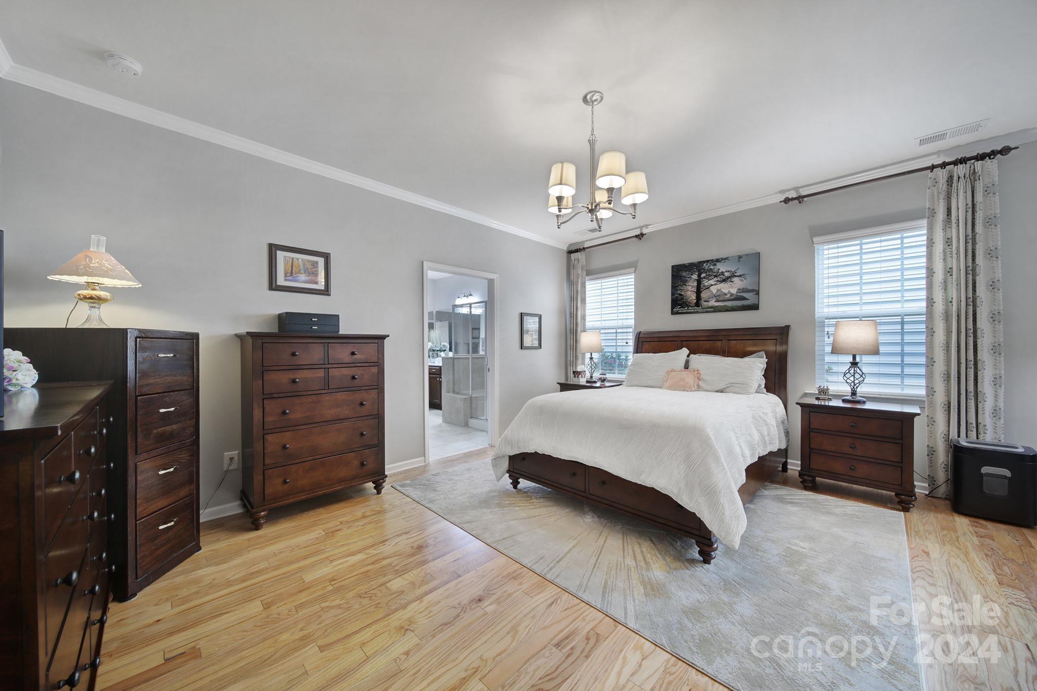 4362 Perth Road Fort Mill, SC 29707 - Photo 12 of 34 a bedroom with a bed and wooden floor