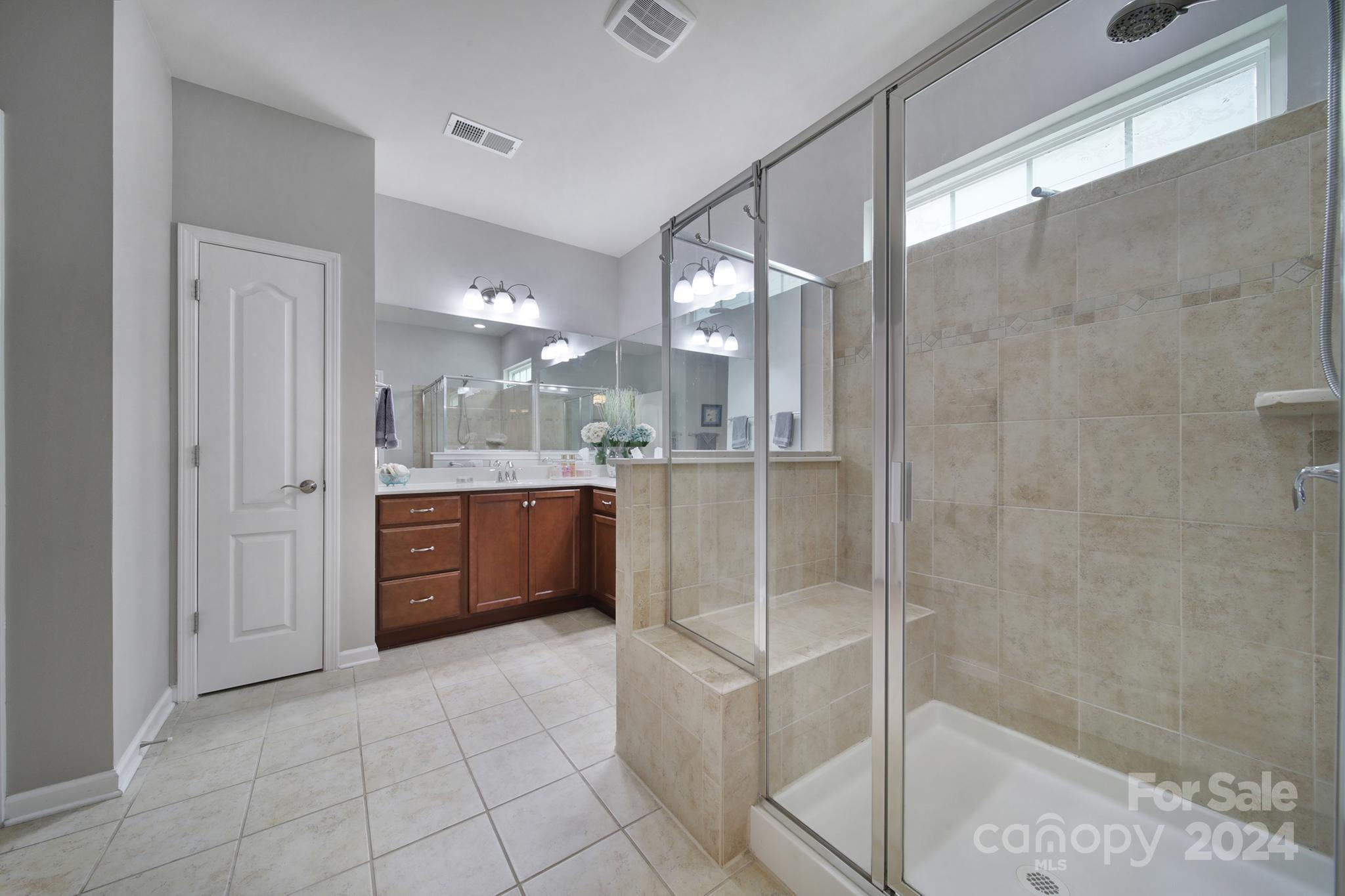 4362 Perth Road Fort Mill, SC 29707 - Photo 18 of 34 a large bathroom with a glass shower door