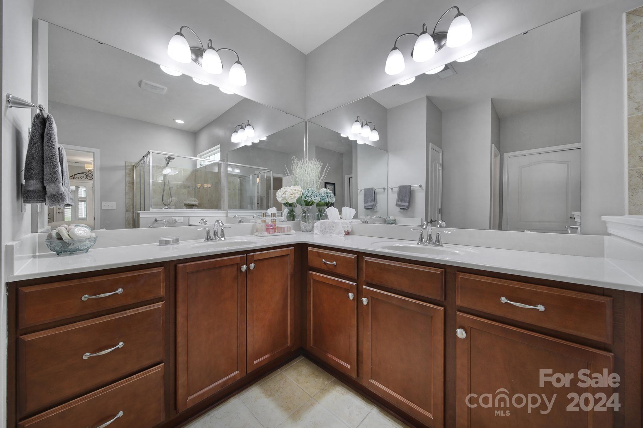 4362 Perth Road Fort Mill, SC 29707 - Photo 19 of 34 a bathroom with a double vanity sink and a mirror with shower