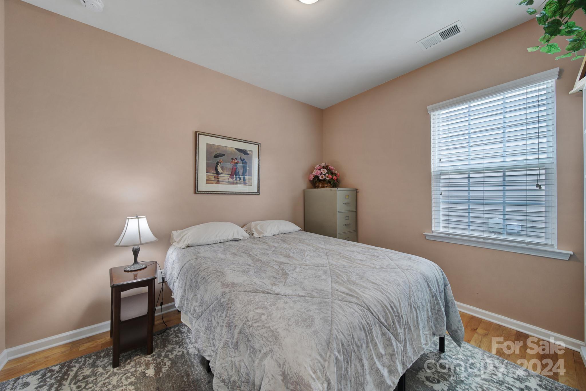 4362 Perth Road Fort Mill, SC 29707 - Photo 24 of 34 a bedroom with a bed and a lamp