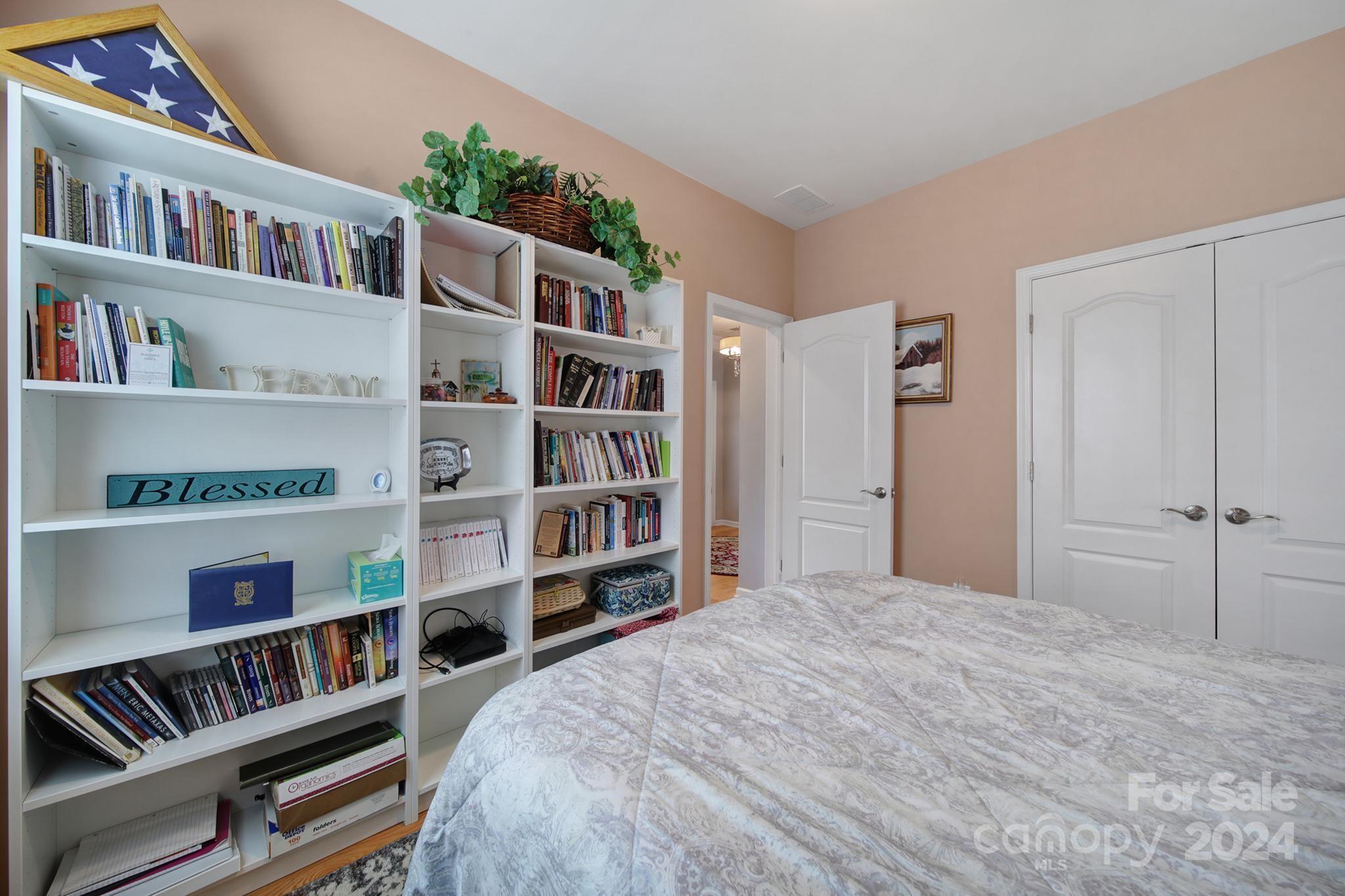 4362 Perth Road Fort Mill, SC 29707 - Photo 25 of 34 a bedroom with a bed and a book shelf