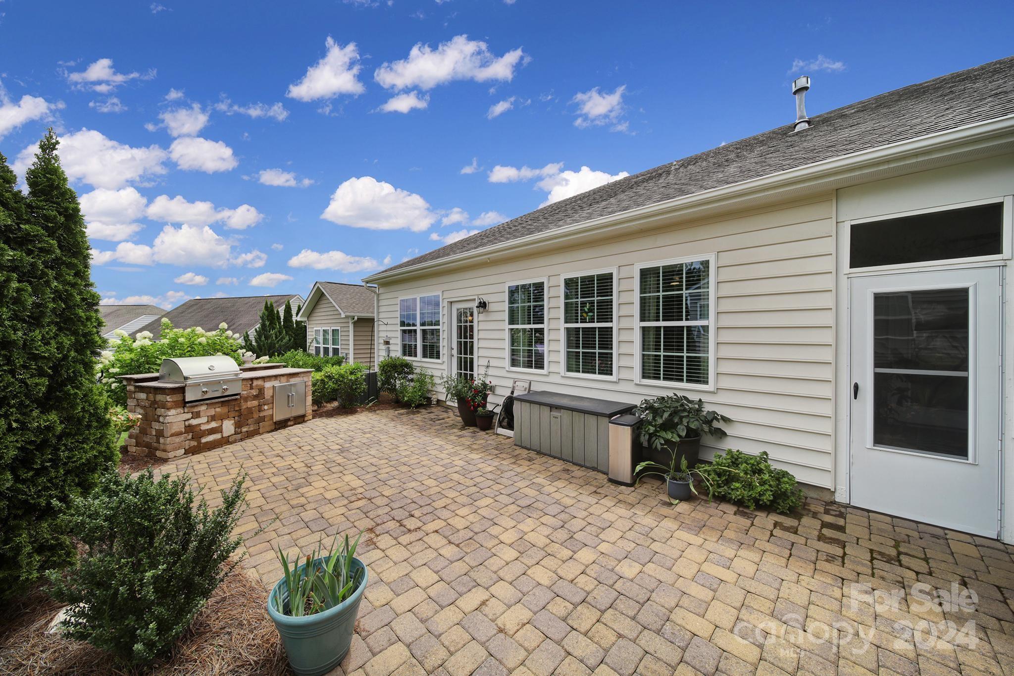4362 Perth Road Fort Mill, SC 29707 - Photo 33 of 34 a front view of a house with a yard and potted plants