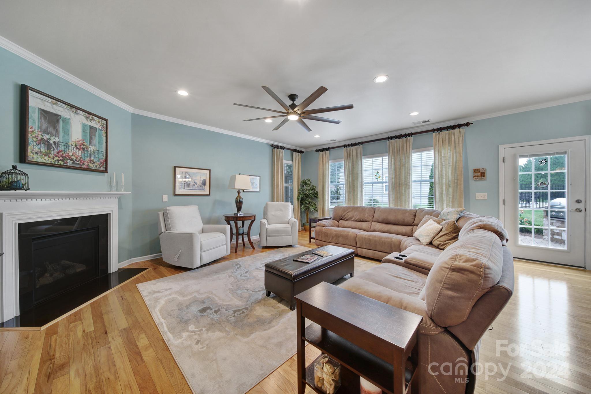 4362 Perth Road Fort Mill, SC 29707 - Photo 9 of 34 a living room with furniture a fireplace and a table