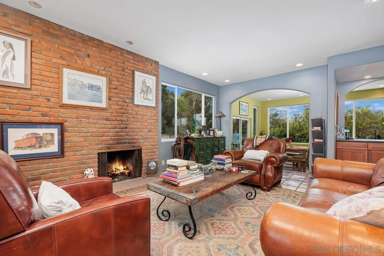 2238 Oceanview Road Oceanside, CA 92056 - Photo 11 of 50 a living room with furniture fireplace and a large window