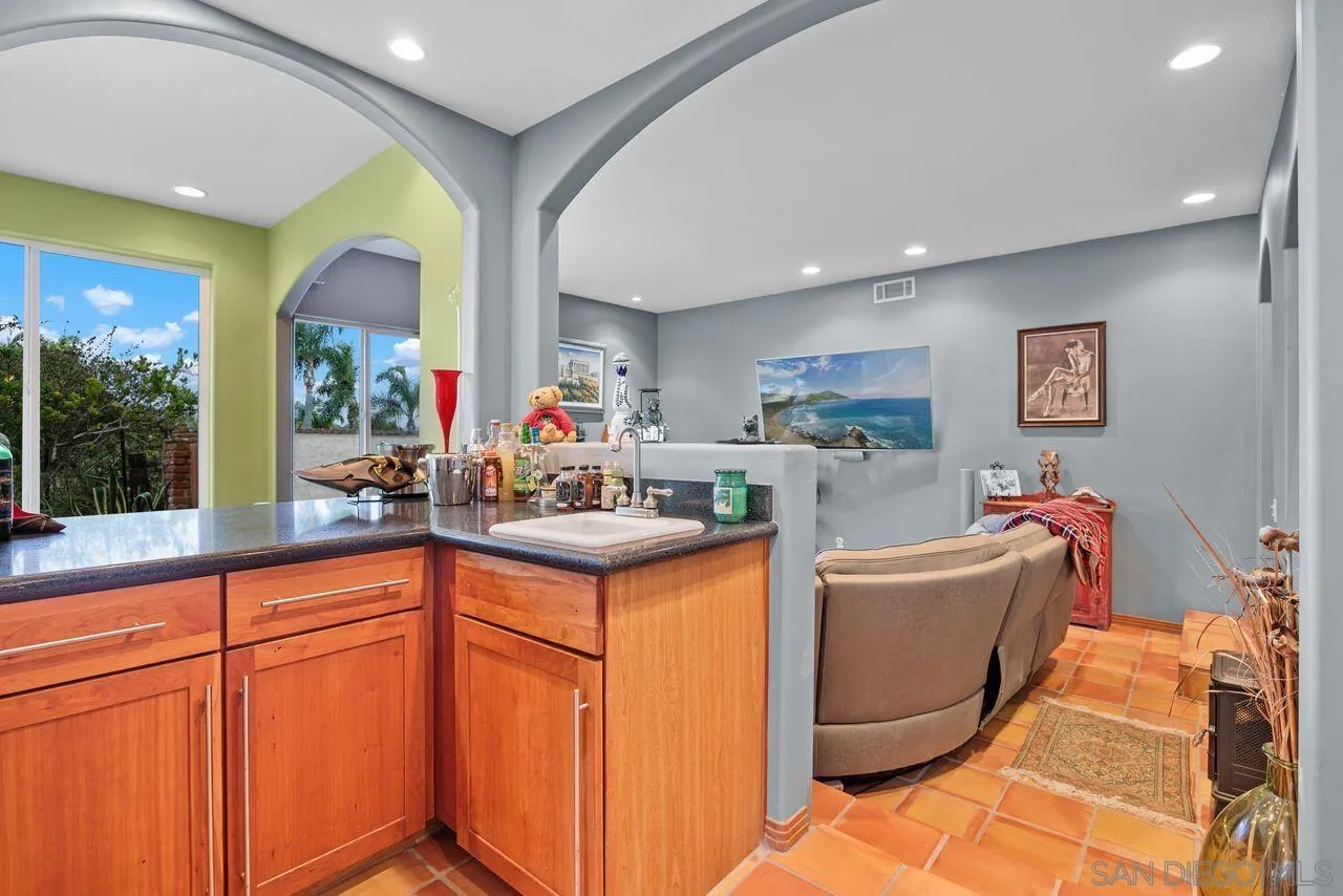 2238 Oceanview Road Oceanside, CA 92056 - Photo 30 of 50 a kitchen with granite countertop a sink and cabinets