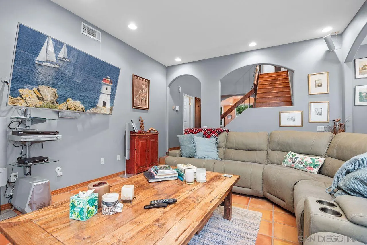 2238 Oceanview Road Oceanside, CA 92056 - Photo 32 of 50 a living room with furniture and painting on the wall