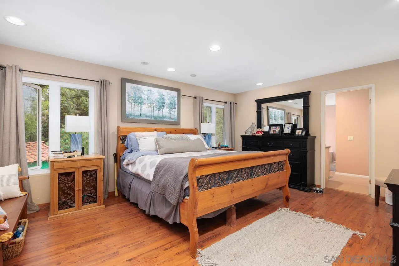 2238 Oceanview Road Oceanside, CA 92056 - Photo 35 of 50 a bed sitting in a bedroom next to a window