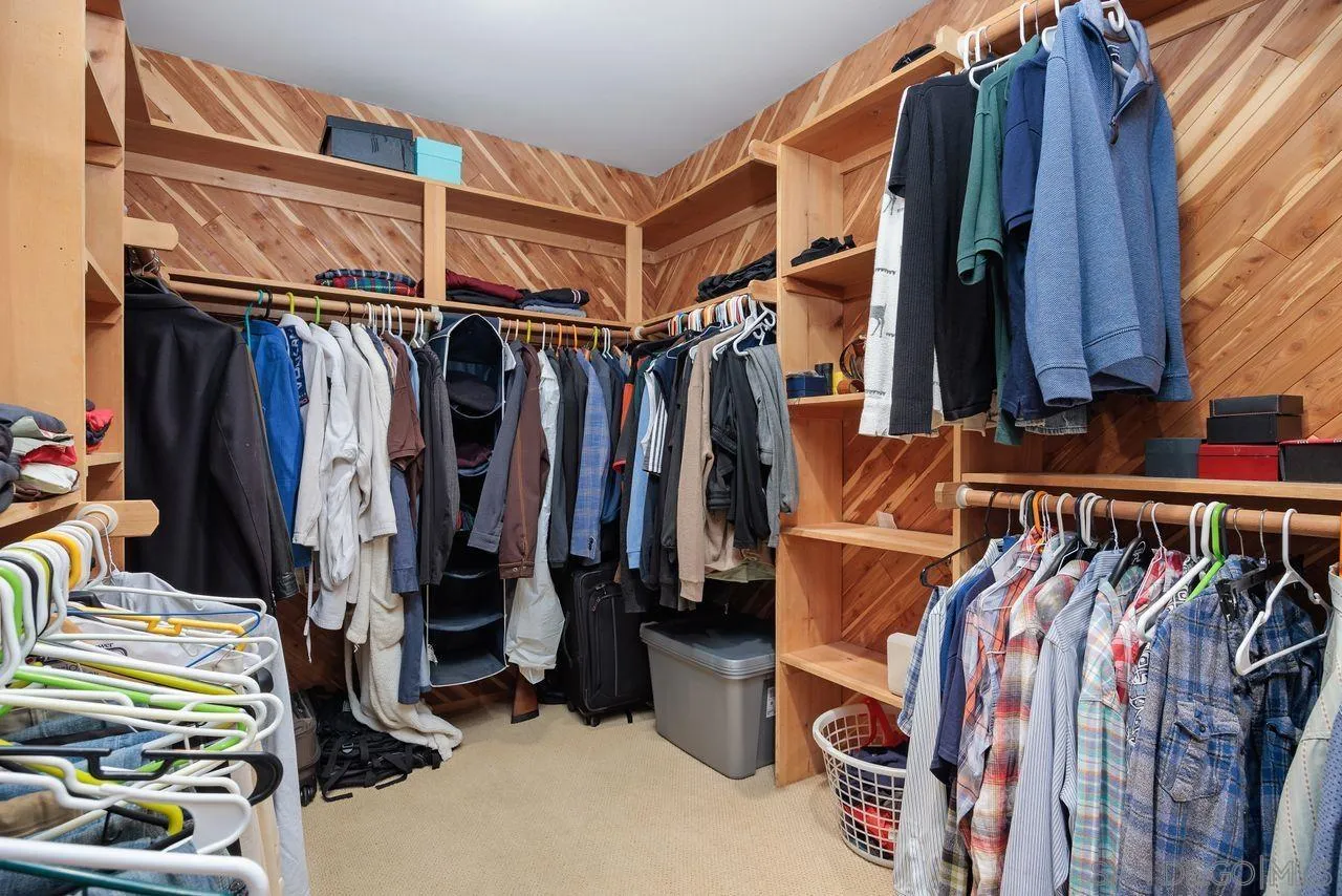 2238 Oceanview Road Oceanside, CA 92056 - Photo 41 of 50 a view of walk in closet with clothes and shoes
