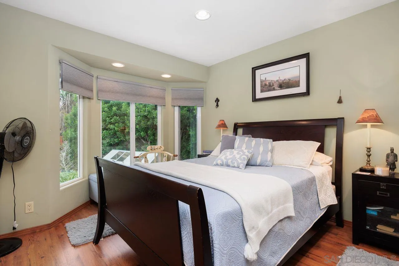 2238 Oceanview Road Oceanside, CA 92056 - Photo 42 of 50 a bedroom with a large bed and a large window