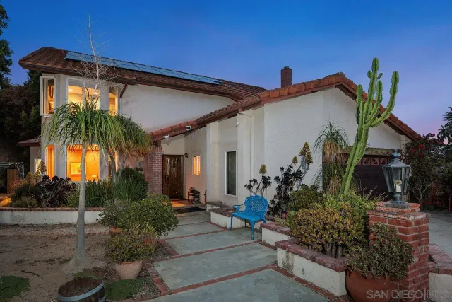 a view of a chairs and table in a patio