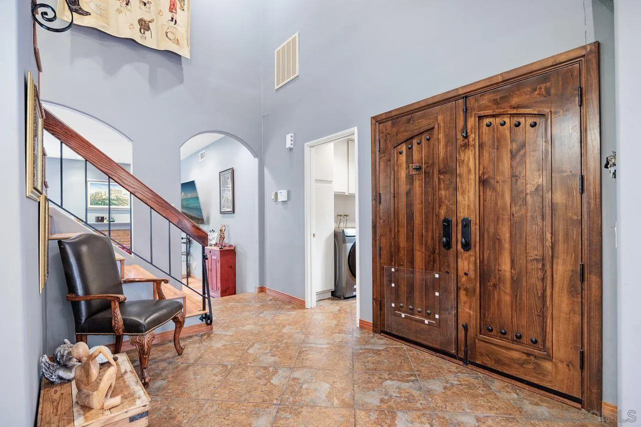 2238 Oceanview Road Oceanside, CA 92056 - Photo 7 of 50 a view of an entryway with wooden floor and stairs