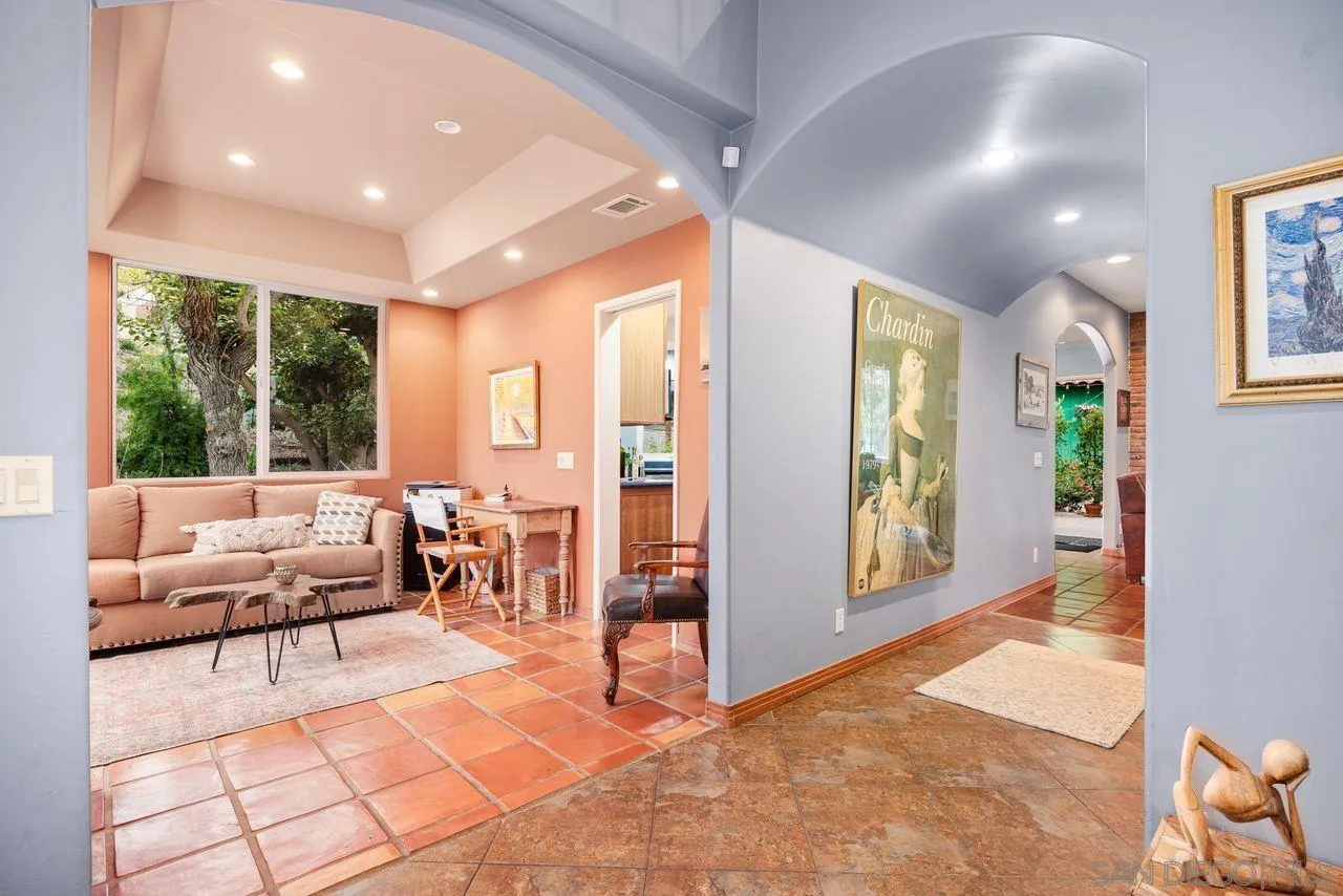 2238 Oceanview Road Oceanside, CA 92056 - Photo 8 of 50 a living room with furniture and large windows