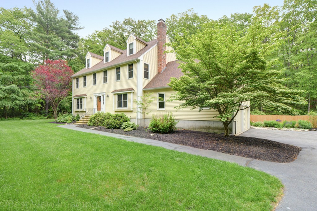 230 Stone School Road Sutton, MA 01590 - Photo 1 of 27 a front view of a house with a garden