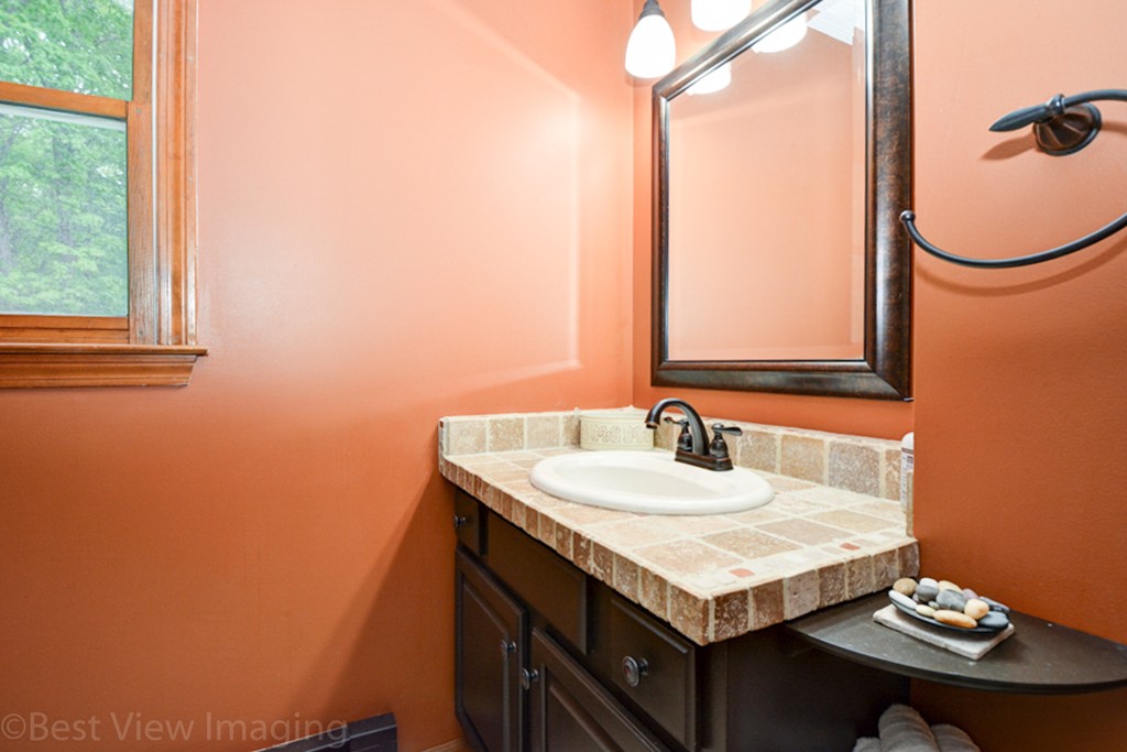 230 Stone School Road Sutton, MA 01590 - Photo 15 of 27 a bathroom with a sink and a mirror