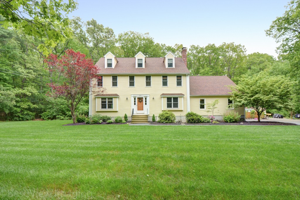 230 Stone School Road Sutton, MA 01590 - Photo 2 of 27 a front view of a house with a garden