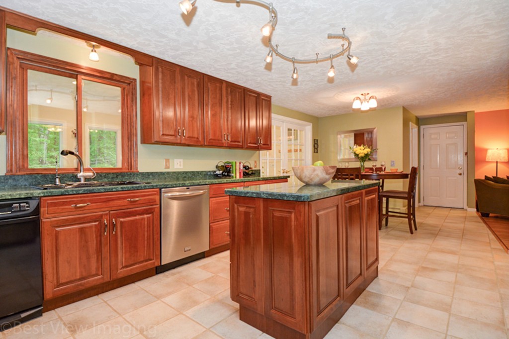 230 Stone School Road Sutton, MA 01590 - Photo 8 of 27 a kitchen with stainless steel appliances granite countertop wooden cabinets a stove top oven a sink and dishwasher