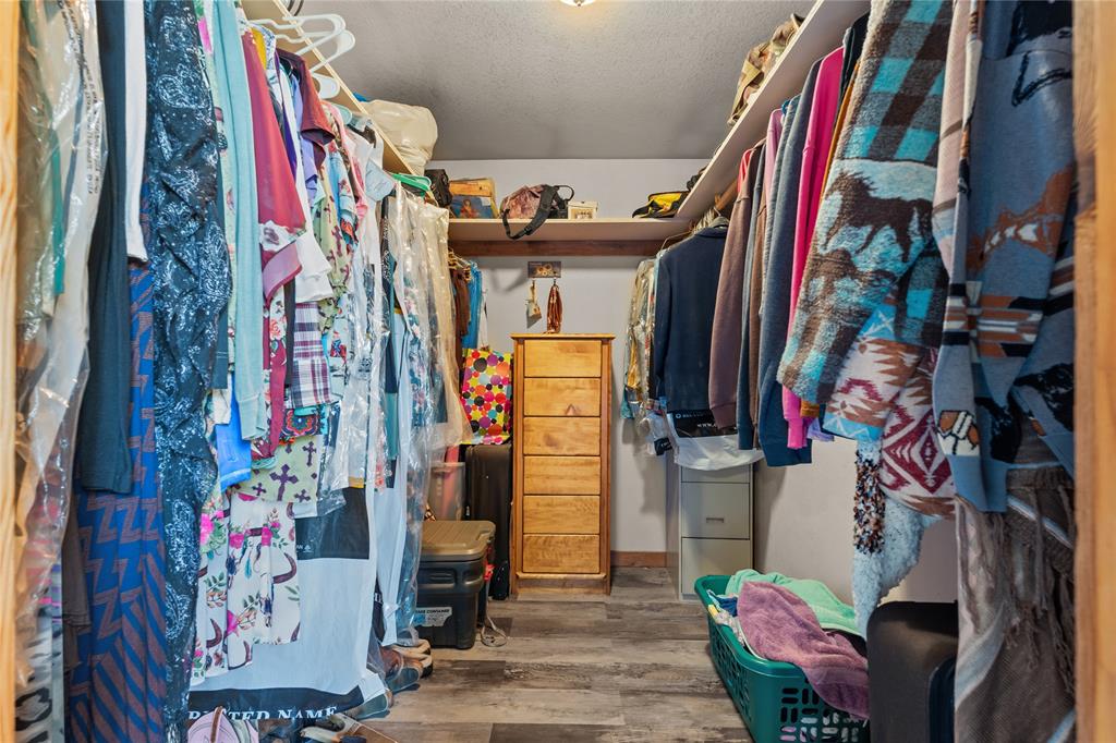 262 North Cheyenne Springtown, TX 76082 - Photo 22 of 35 a view of walk in closet with clothes and shoes