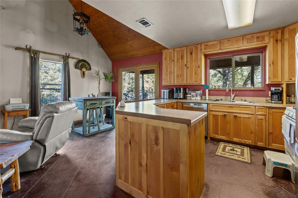 262 North Cheyenne Springtown, TX 76082 - Photo 35 of 35 a kitchen with sink refrigerator and window