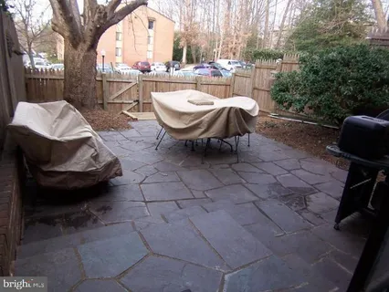 a view of a chairs and table in the patio