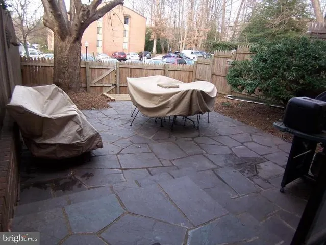 a view of a chairs and table in the patio