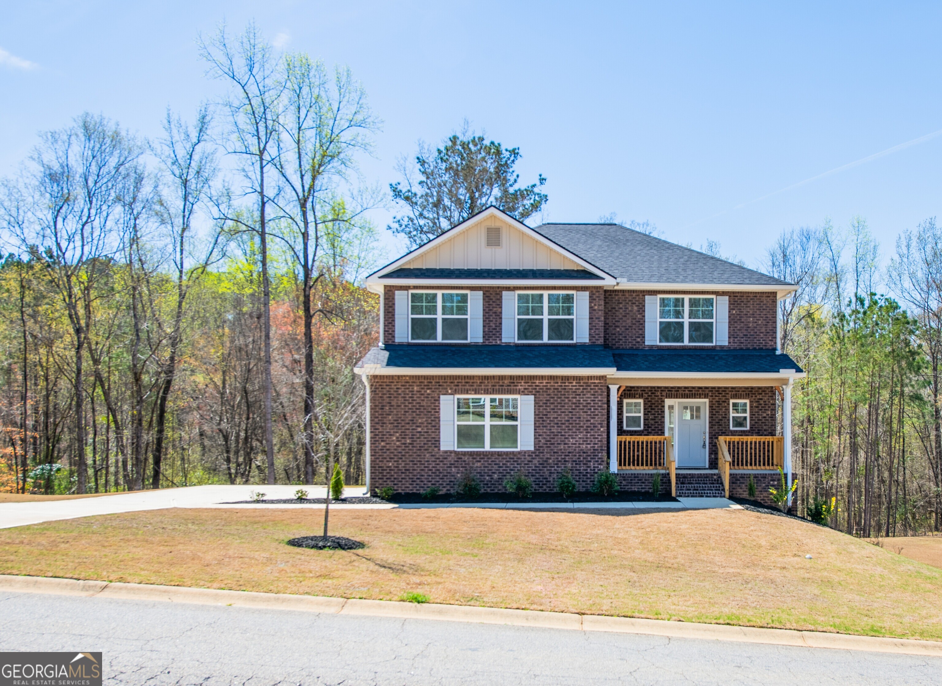 229 Carsons Walk Macon, GA 31206 - Photo 1 of 43 a front view of a house with a yard and garage