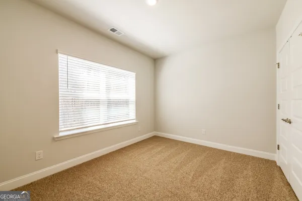 an empty room and closet area