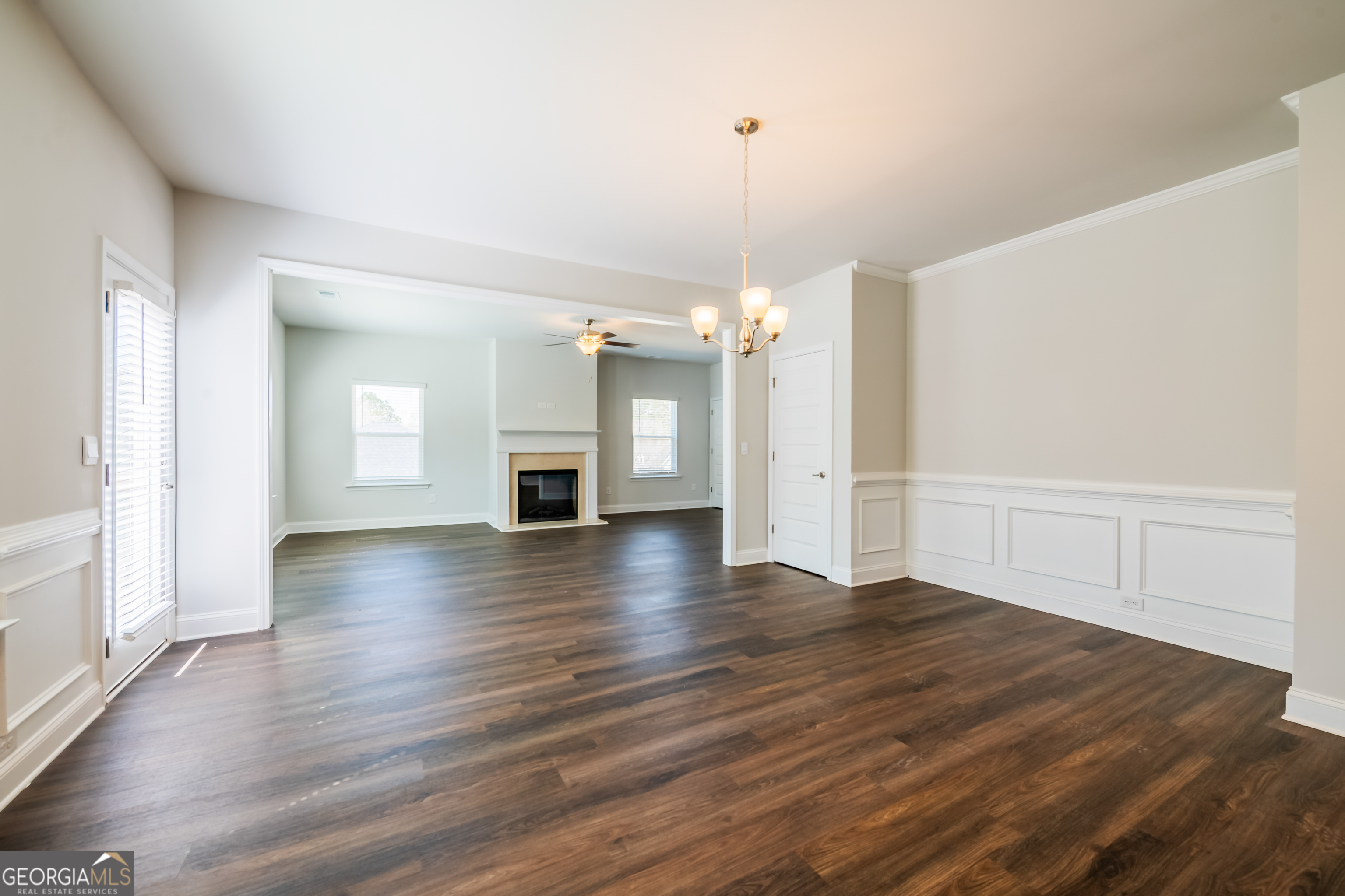 229 Carsons Walk Macon, GA 31206 - Photo 9 of 43 an empty room with wooden floor and fireplace