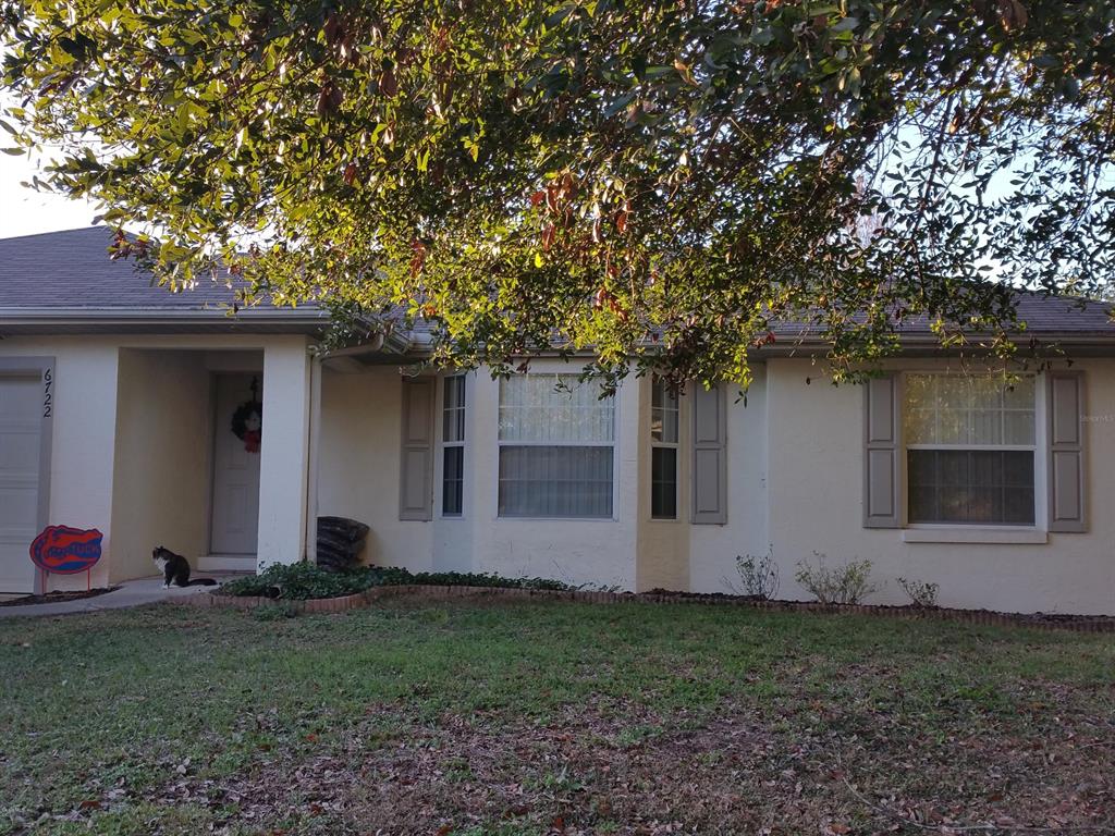 6722 Cherry Road Ocala, FL 34472 - Photo 1 of 1 a backyard of a house with lots of green space