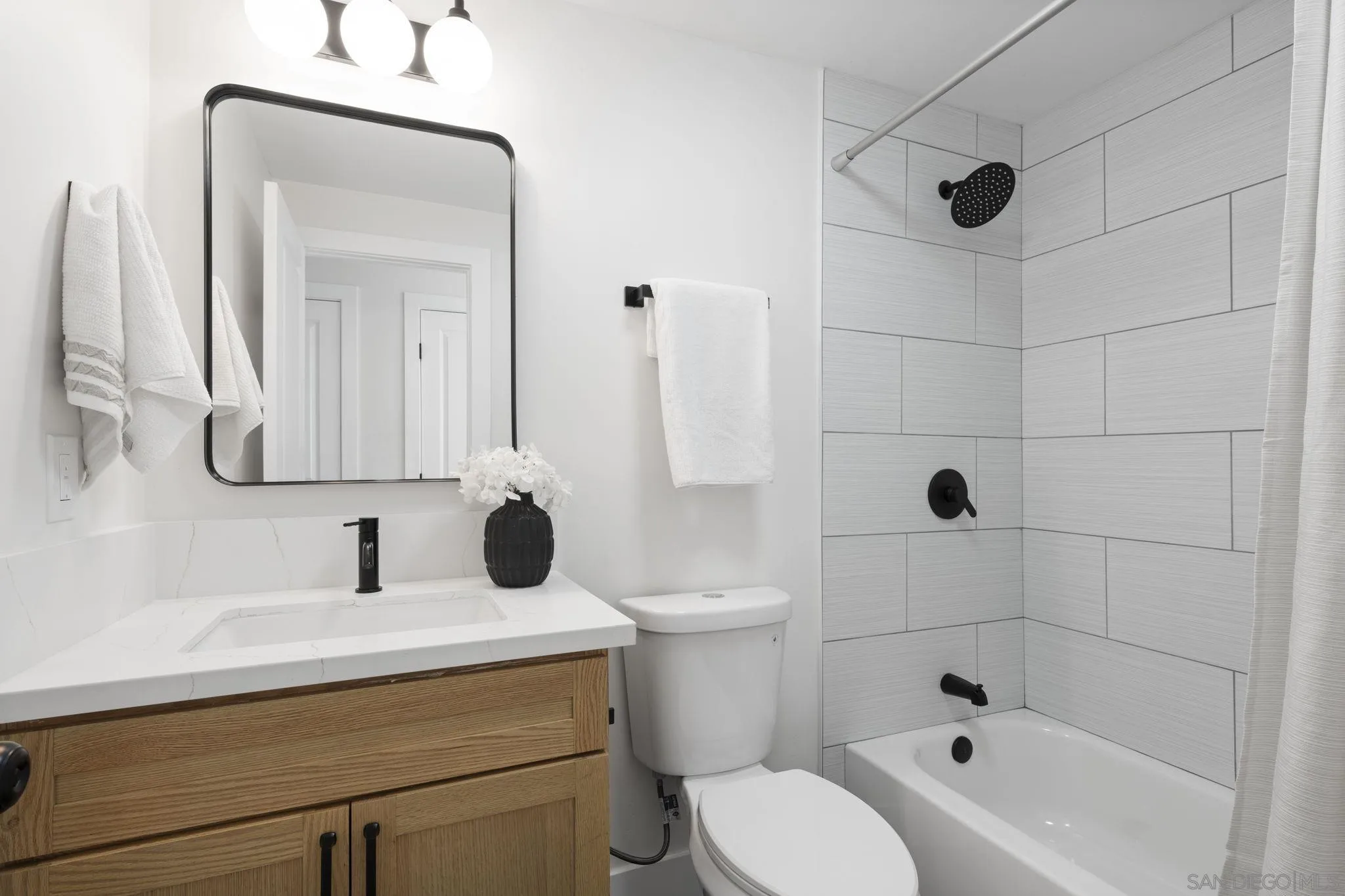 13442 Mountainside Drive Poway, CA 92064 - Photo 13 of 18 a bathroom with a sink a toilet and shower