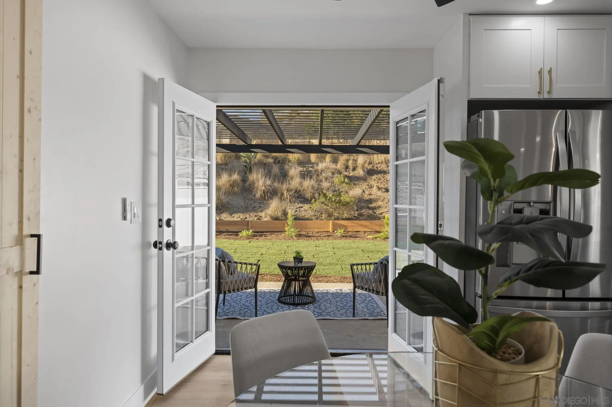 13442 Mountainside Drive Poway, CA 92064 - Photo 4 of 18 a living room with furniture and a floor to ceiling window