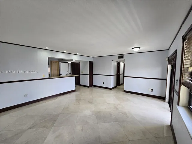 a living room with a table and gym equipment