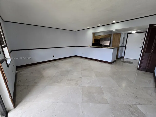 a view of an empty room with racks on the wall