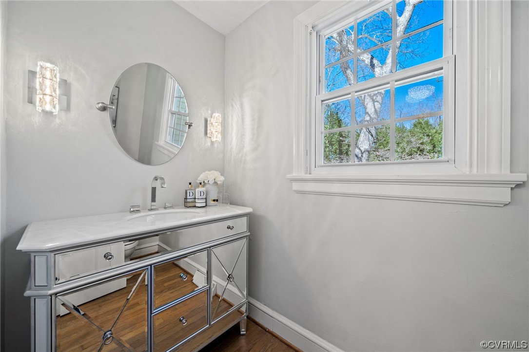 2039 Albion Road Midlothian, VA 23113 - Photo 17 of 49 a bathroom with a sink a vanity and a mirror