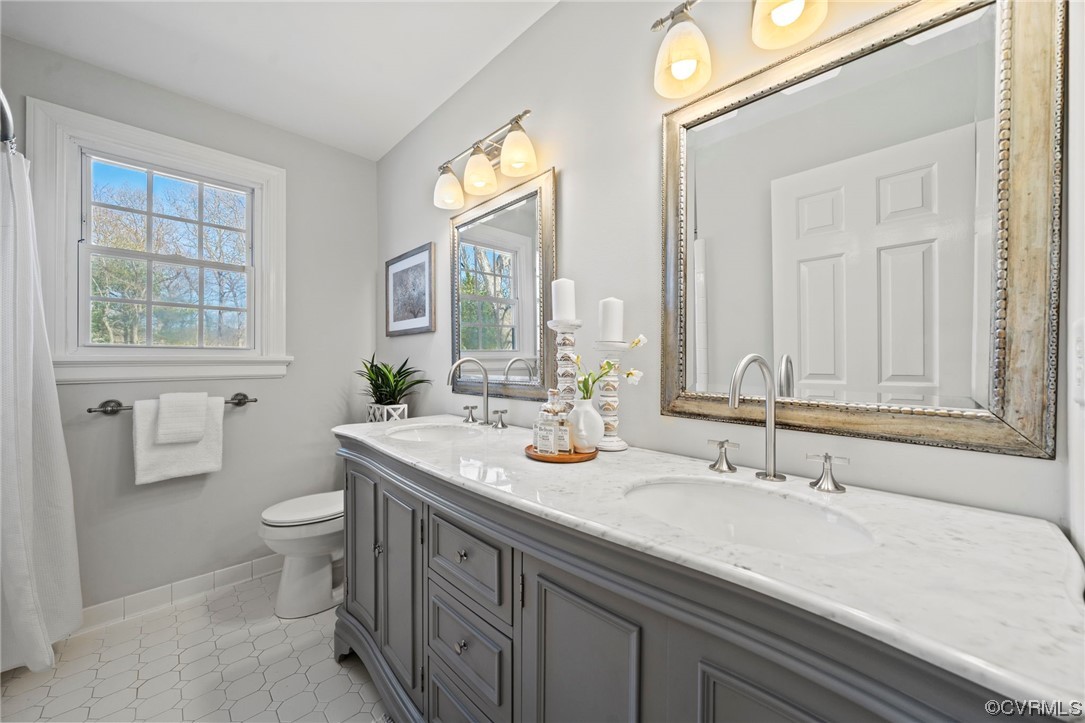 2039 Albion Road Midlothian, VA 23113 - Photo 27 of 49 a bathroom with a sink double vanity and a toilet