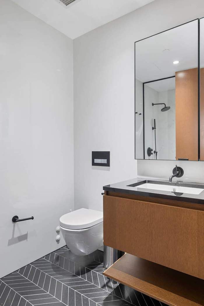 570 Broome Street, Unit 12B Manhattan, NY 10013 - Photo 11 of 17 a bathroom with a sink and a toilet