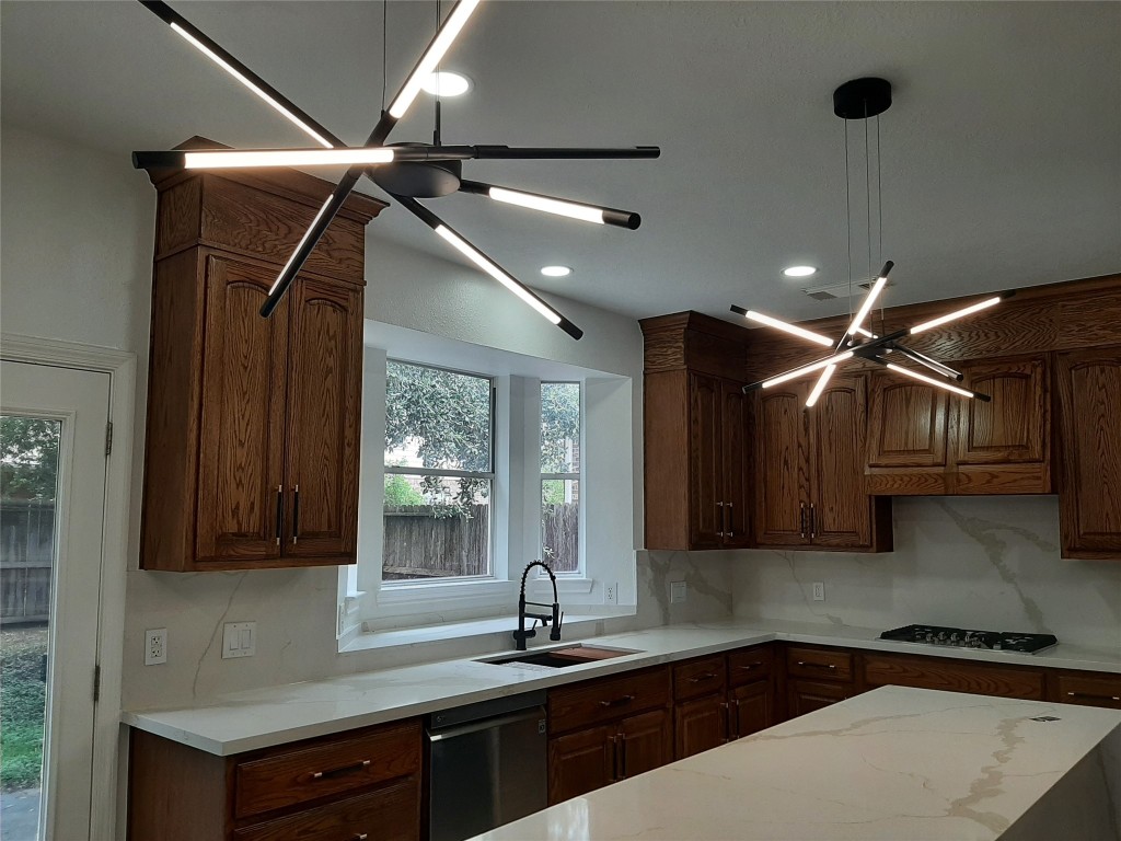 4214 Blue Sage Terrace Spring, TX 77388 - Photo 20 of 50 a kitchen with a sink cabinets and window