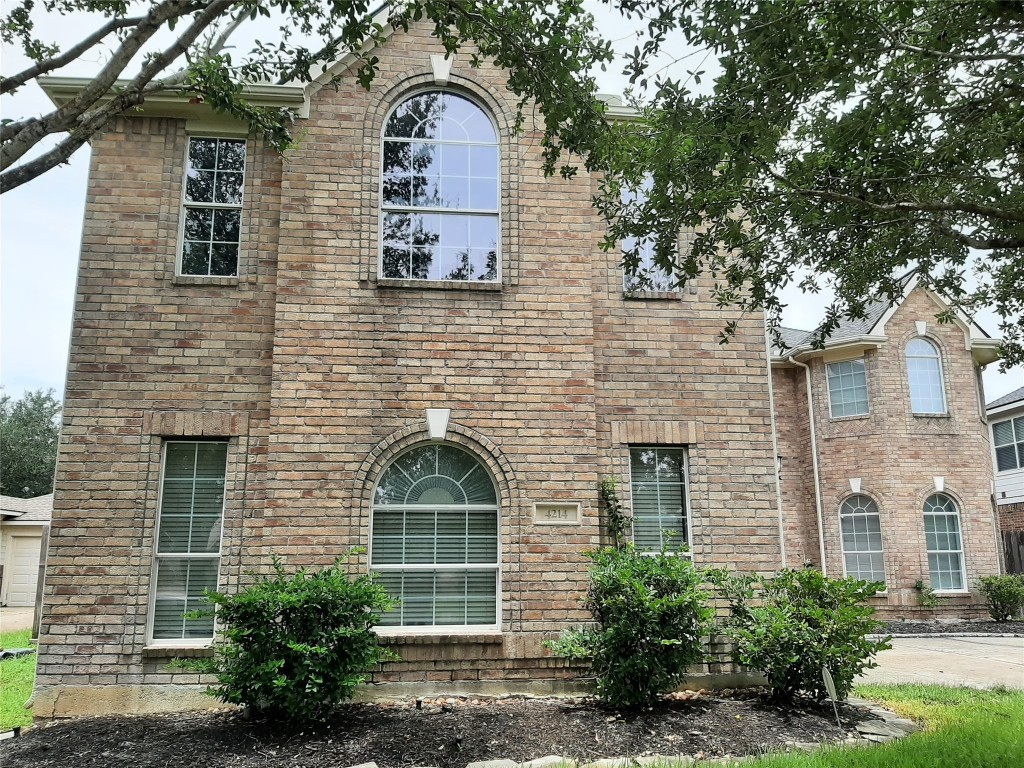 4214 Blue Sage Terrace Spring, TX 77388 - Photo 2 of 50 a front view of a house with garden