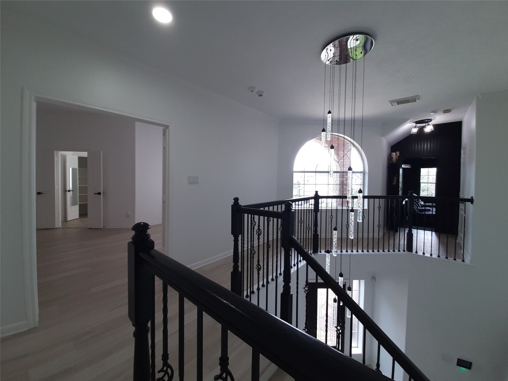 4214 Blue Sage Terrace Spring, TX 77388 - Photo 30 of 50 a view of a hallway with wooden floor and entryway