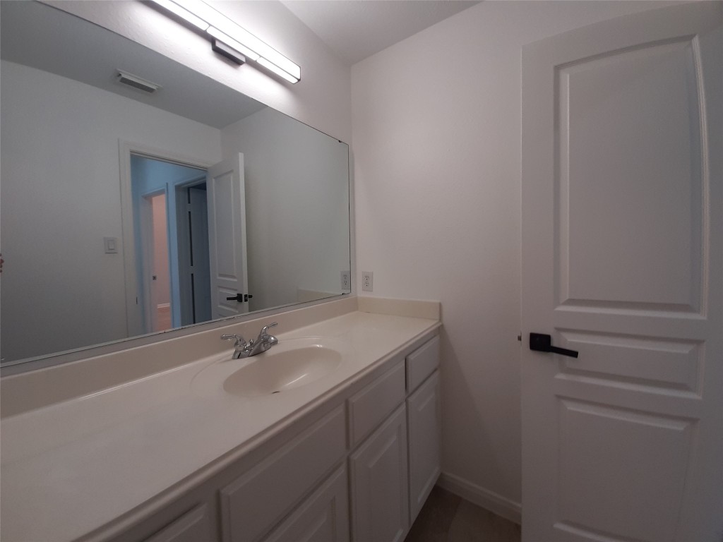 4214 Blue Sage Terrace Spring, TX 77388 - Photo 39 of 50 a bathroom with a sink and a mirror