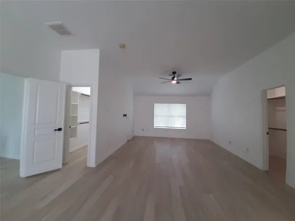 a view of an empty walk in closet