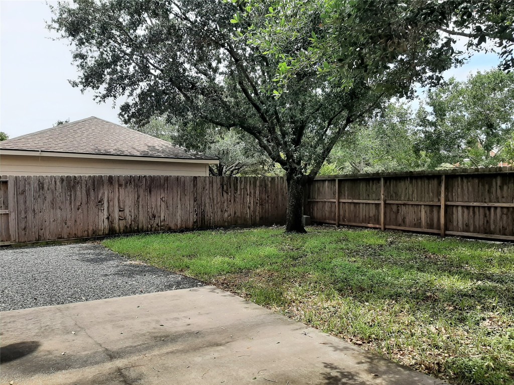 4214 Blue Sage Terrace Spring, TX 77388 - Photo 48 of 50 a view of a backyard with wooden fence and large trees